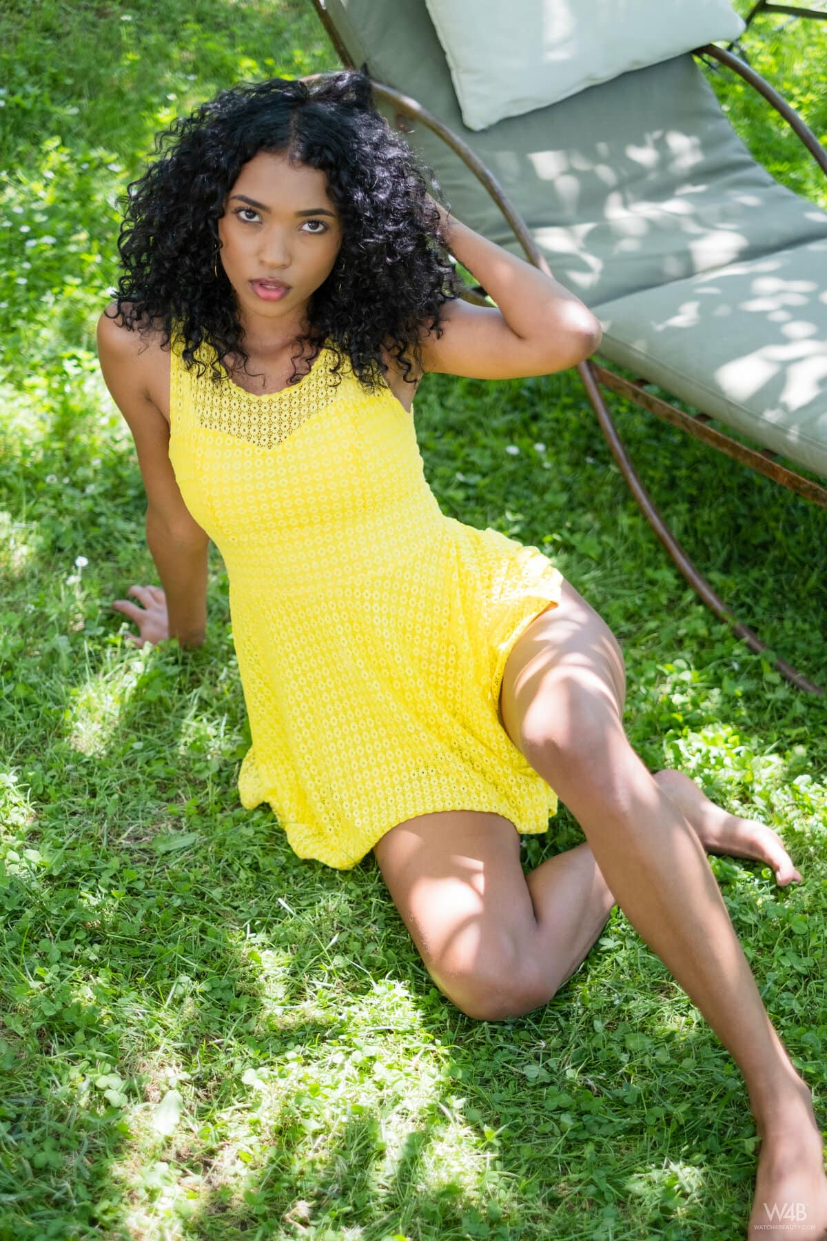 Barbie slowly removes her yellow dress and sensually spreads her legs outdoors