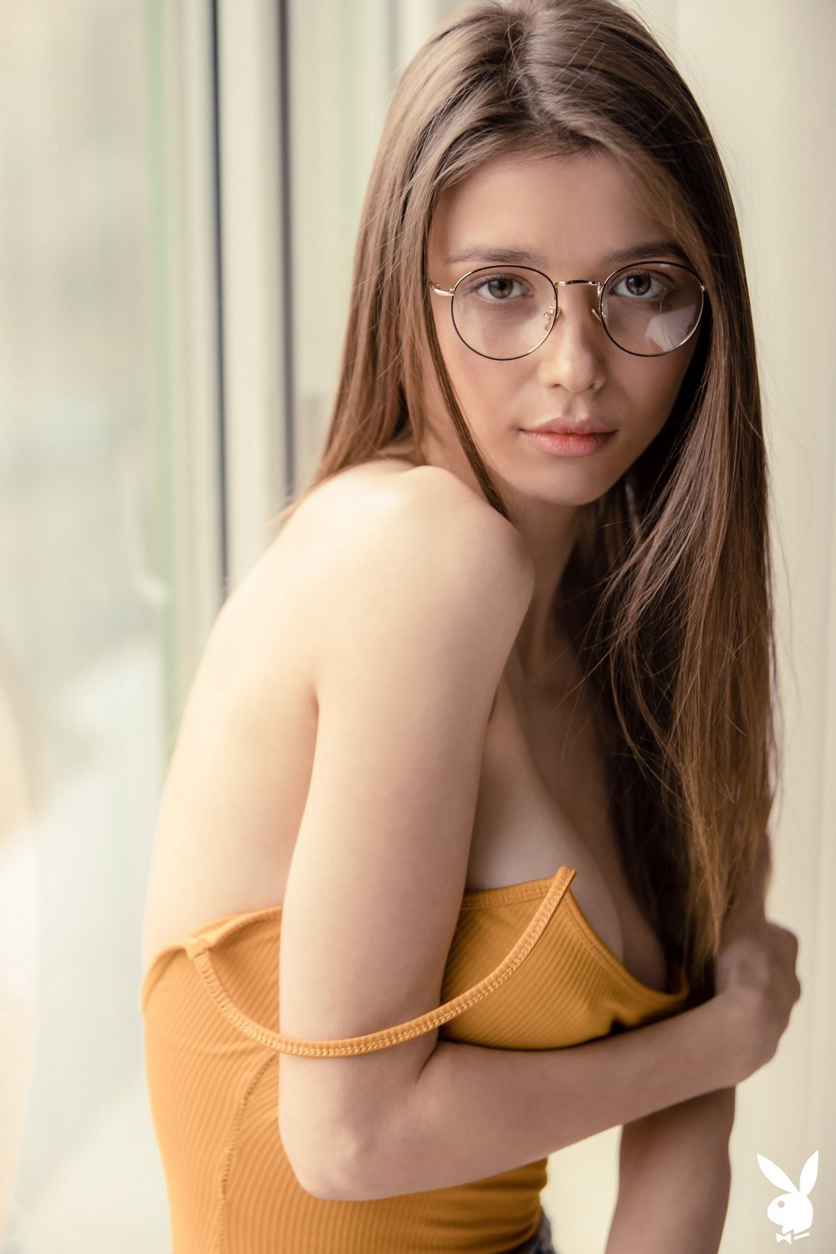 Mila Azul looks sexy and innocent while stripping with her glasses on