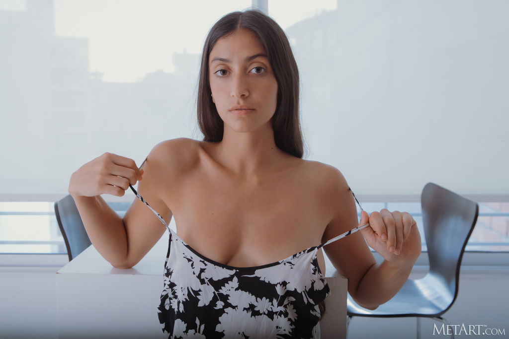 Fedra Smiling Flirtatiously As She Lets The Straps Of Her Dress Slide From Her Shoulders