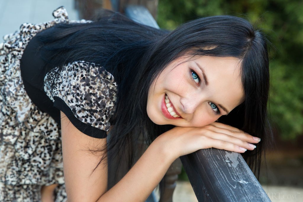 Yvonne A - Dark haired beauty strips outdoors on a balcony