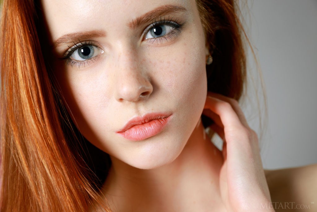 Bella Milano - Shaved, cute redhead slips off her black bra and panties