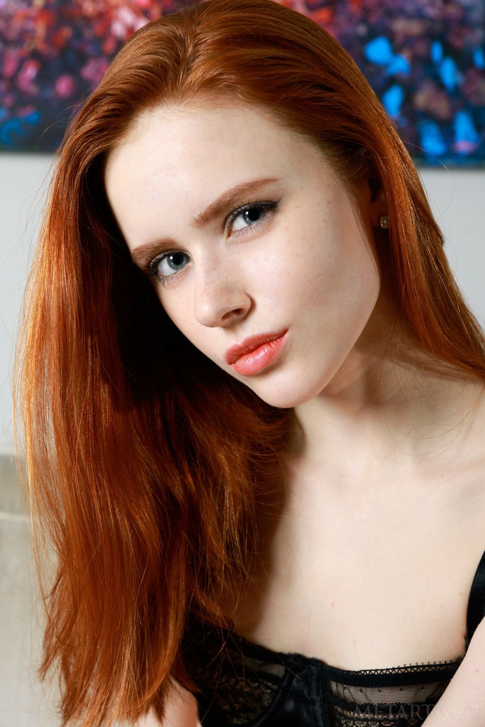 Bella Milano - Shaved, cute redhead slips off her black bra and panties