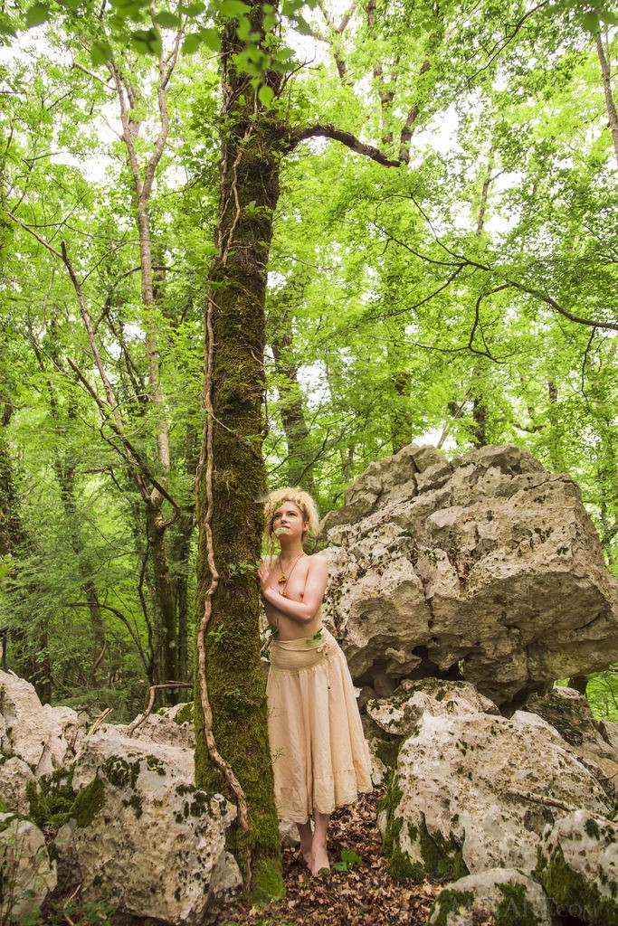 Taylor - Sexy, curly haired blonde has fun getting naked in nature