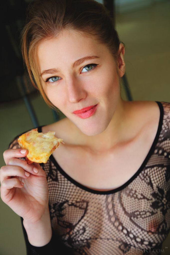 Mila I - Eating some pizza while slithering out of her lace bodysuit