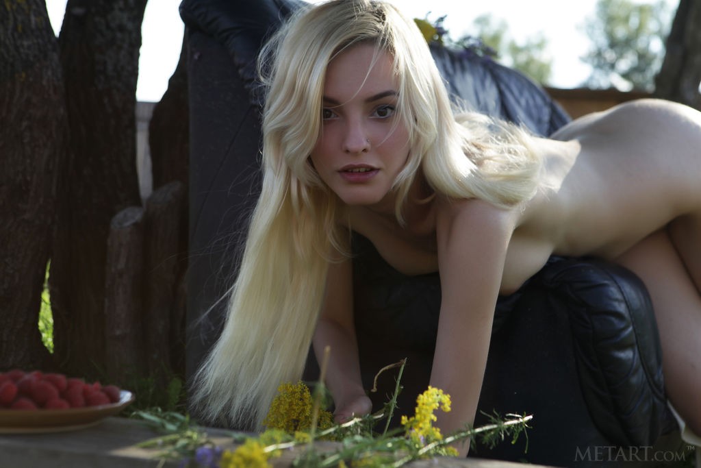 Kira W - Skinny, beautiful blonde teases nipples with some flowers