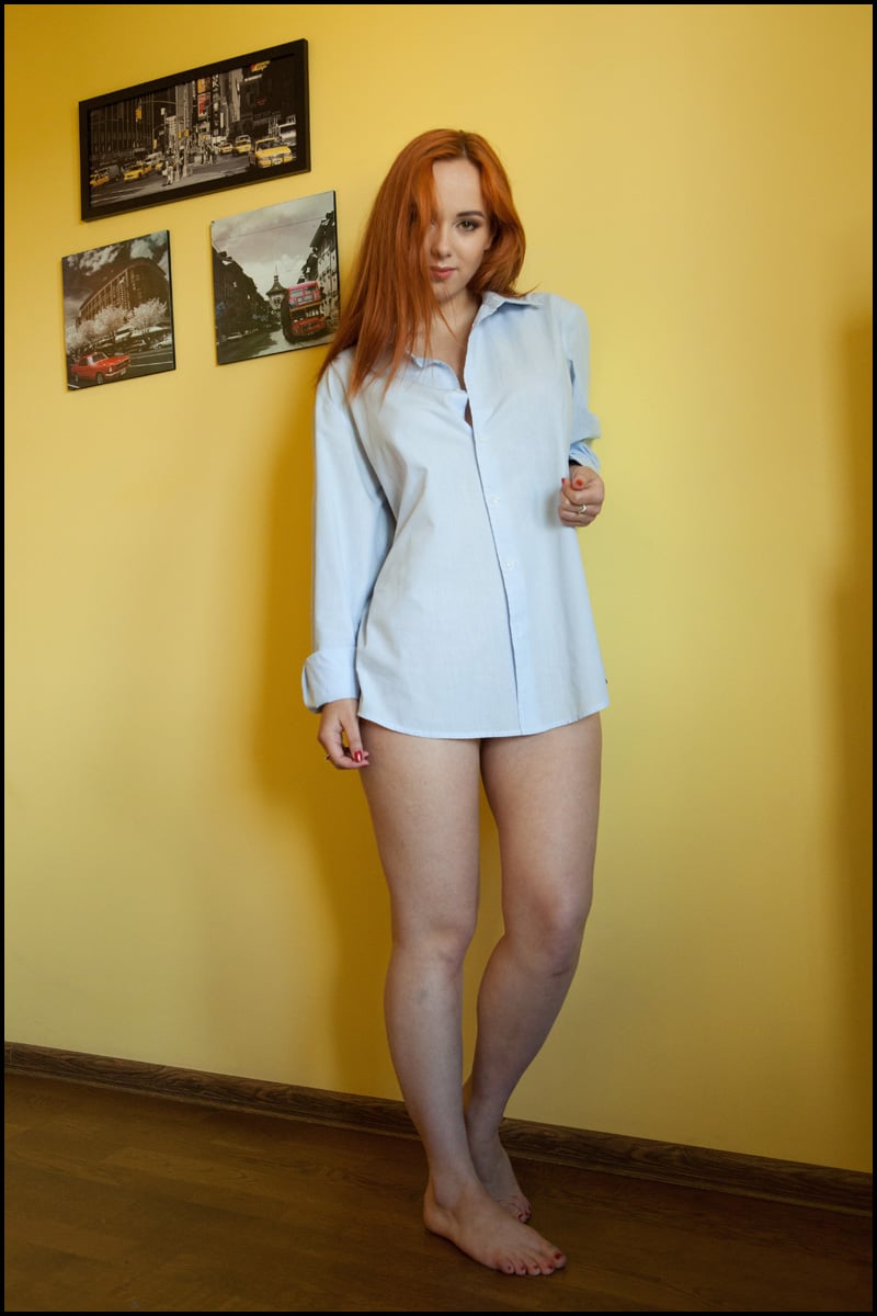 Tattooed redhead Lilli Lovey shows her pink pussy